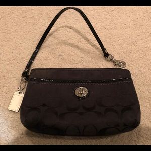 Black monogrammed Coach wristlet